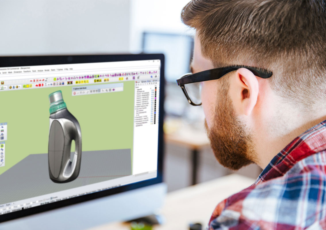 Designer creating a CAD model on his computer of a washing liquid bottle